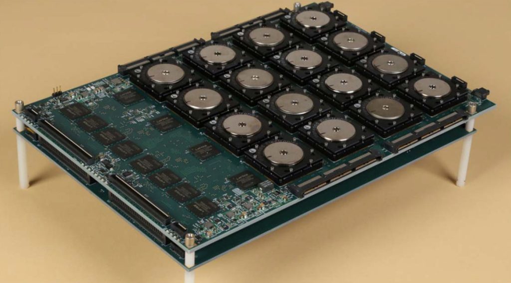 A circuit board carrying a neuromorphic chip.